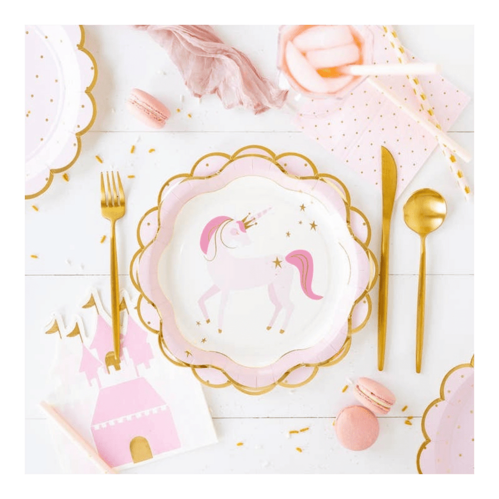 Pink unicorn paper plate with gold edge and castle napkin princess theme from Parte Haus party supply store in Bethesda, Maryland.