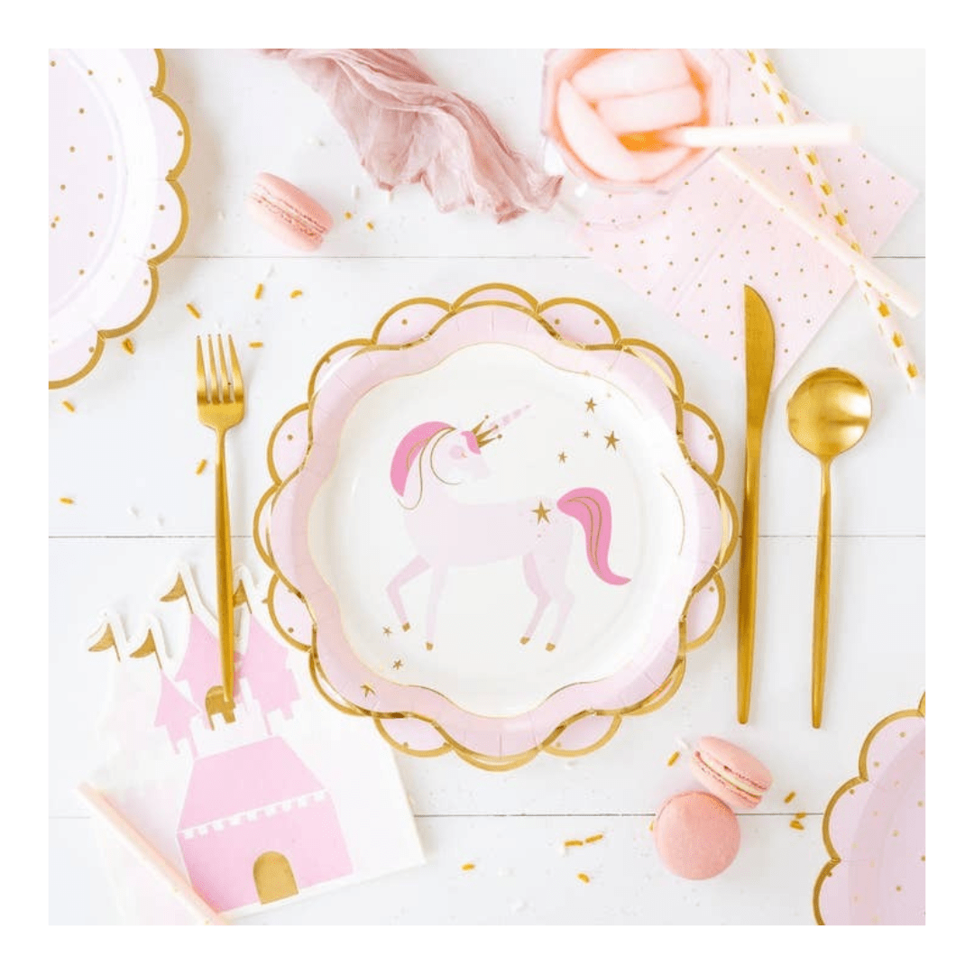 Pink unicorn paper plate with gold edge and castle napkin princess theme from Parte Haus party supply store in Bethesda, Maryland.