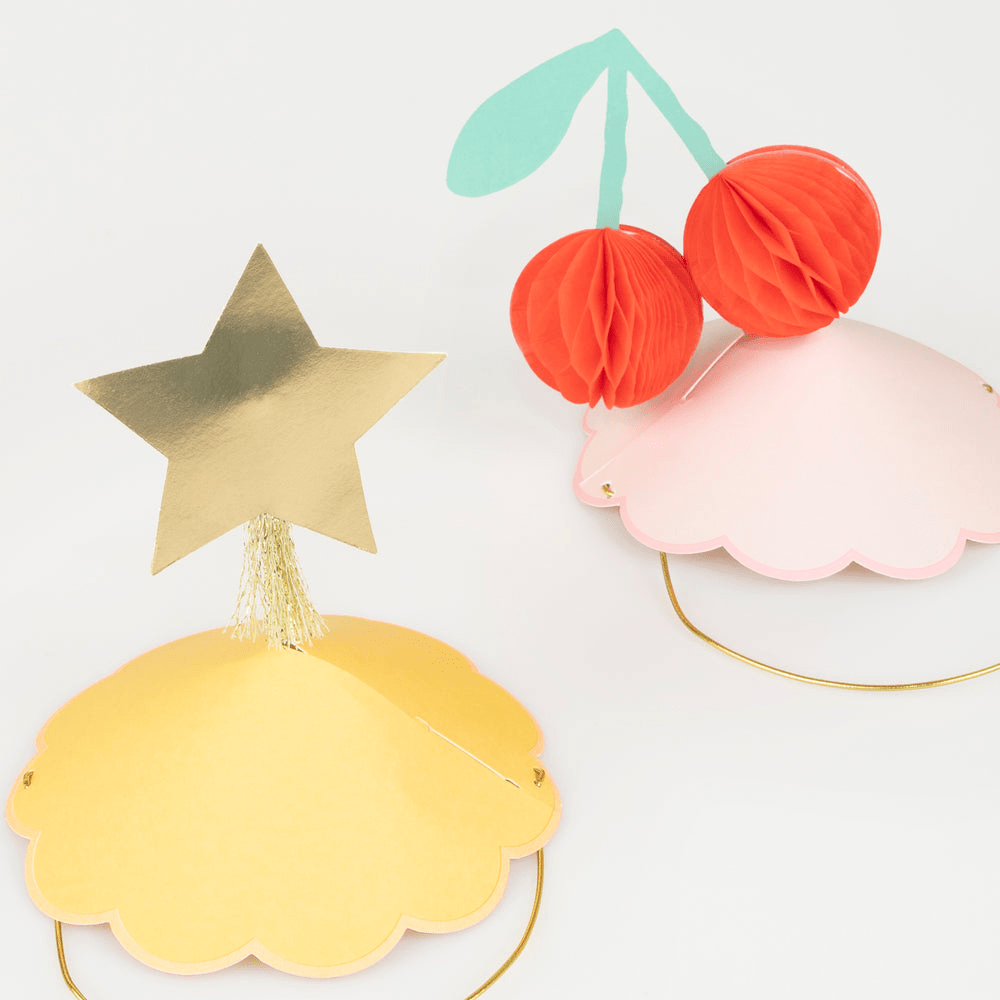 Gold and pink kids hats with star and cherry toppers birthday decoration from Parte Haus party supply store in Bethesda Maryland