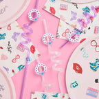 Pink and purple swirly straws with party prints and matching plates birthday theme from Parte Haus party supply store in Bethesda MD