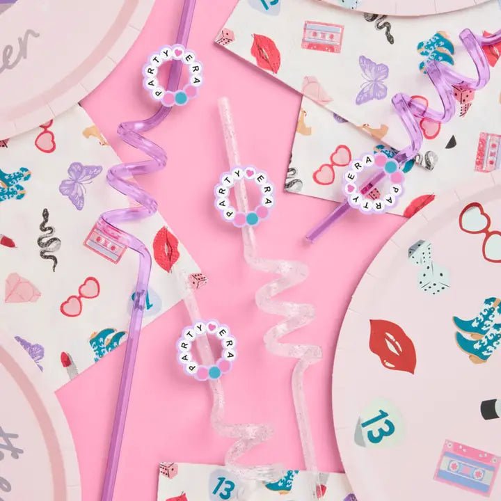Pink and purple swirly straws with party prints and matching plates birthday theme from Parte Haus party supply store in Bethesda MD