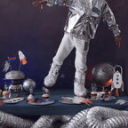 silver and white space themed party decorations cupcakes and astronaut costume for space birthday from Parte Haus party supply store in Bethesda MD