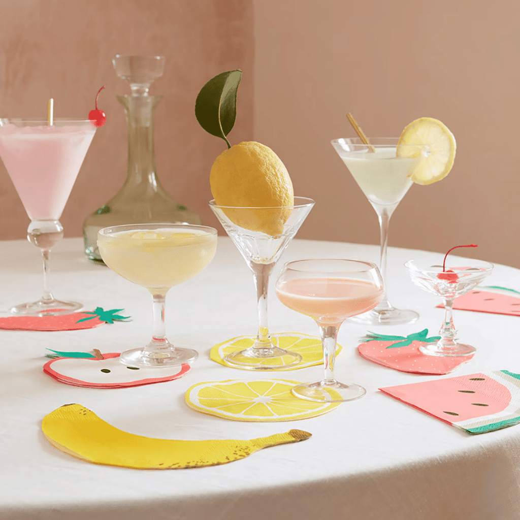 Multicolor fruit shaped napkins and coasters with cocktails summer theme from Parte Haus party supply store in Bethesda Maryland