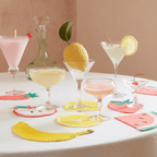 Multicolor fruit shaped napkins and coasters with cocktails summer theme from Parte Haus party supply store in Bethesda Maryland