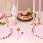 Pastel pink tableware with scalloped edges and peaches celebrates birthday from Parte Haus party supply store in Bethesda MD