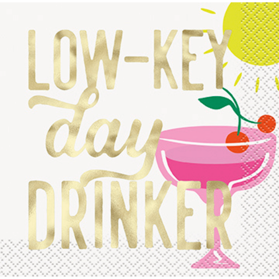 Gold pink cocktail napkin with sun cherries and Low Key Day Drinker text summer theme from Parte Haus party supply store in Bethesda Maryland