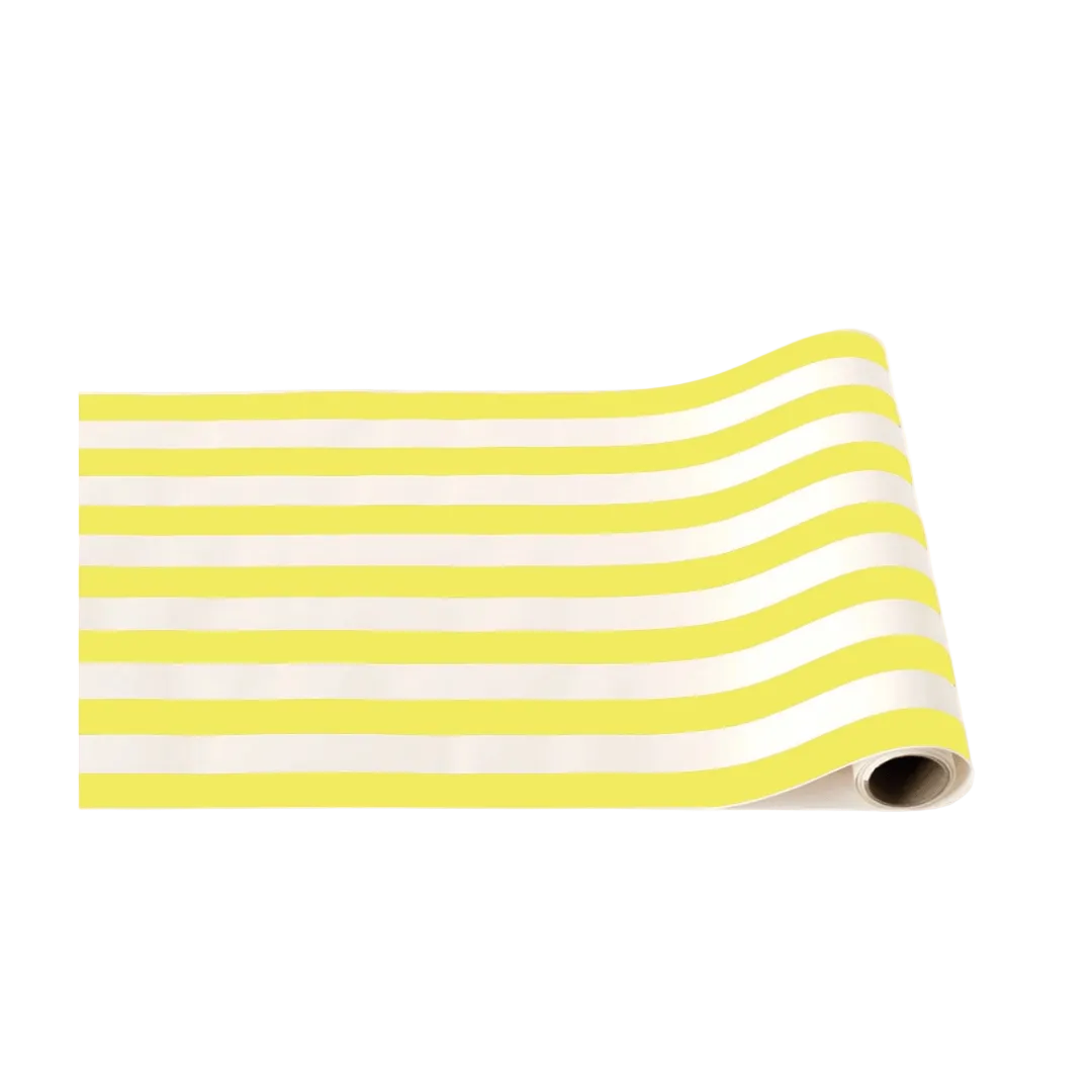 Yellow striped table runner rolled for birthday decoration from Parte Haus party supply store in Bethesda Maryland
