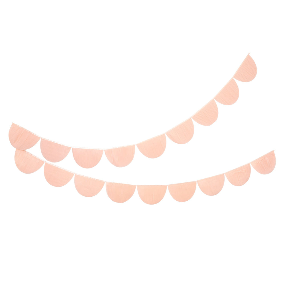 Blush pink garland banner with half circle shapes birthday or event decor from Parte Haus party supply store in Bethesda MD