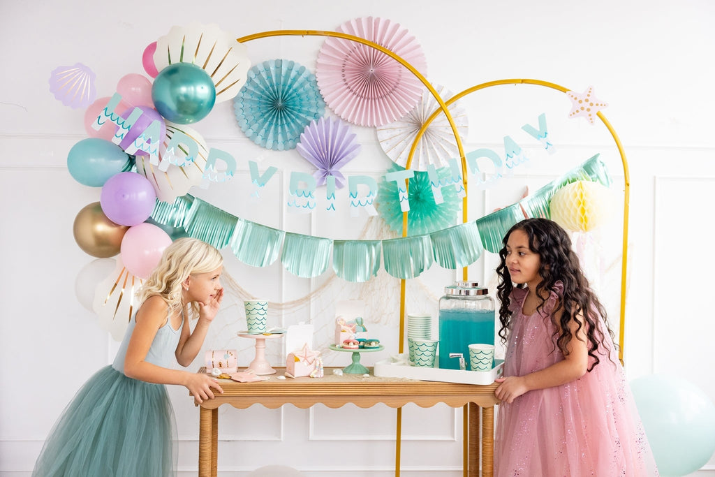 Blue and pink mermaid birthday decorations with balloons and banners for kids from Parte Haus party supply store in Bethesda MD