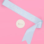 Light blue bride to be sash with rhinestone text for bridal shower from Parte Haus party supply store in Bethesda MD