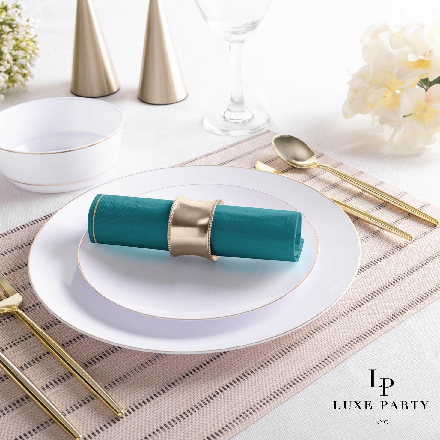 Gold and teal table setting with plates and cutlery for elegant dinner from Parte Haus party supply store in Bethesda Maryland