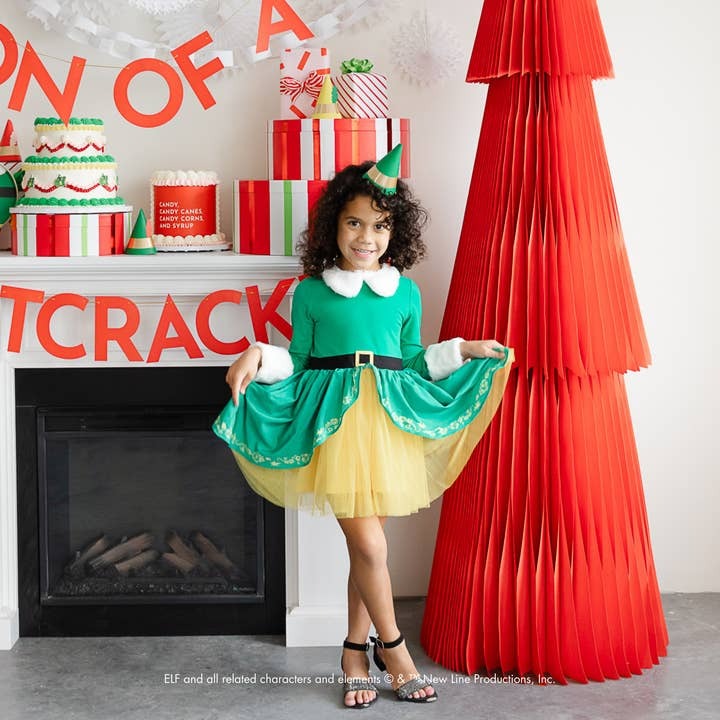 Green and yellow elf costume dress for Christmas with child posing from Parte Haus party supply store in Bethesda MD