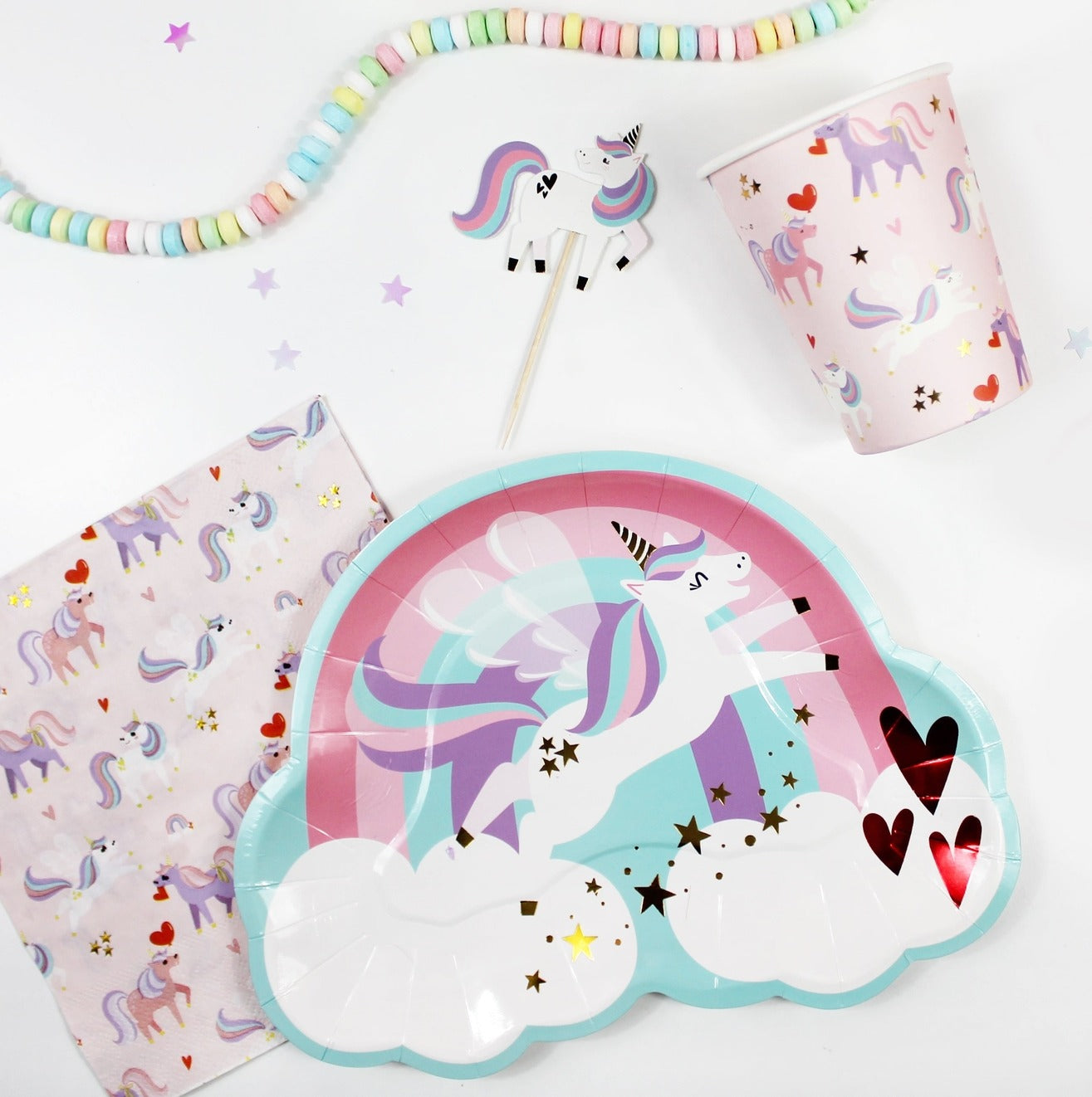 Pastel unicorn plate napkin and cup with rainbow and cloud birthday theme from Parte Haus party supply store in Bethesda MD