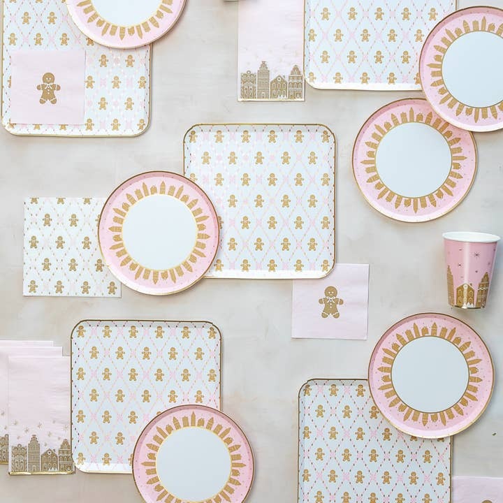 Pink and gold holiday plates cups and napkins gingerbread theme from Parte Haus party supply store in Bethesda MD