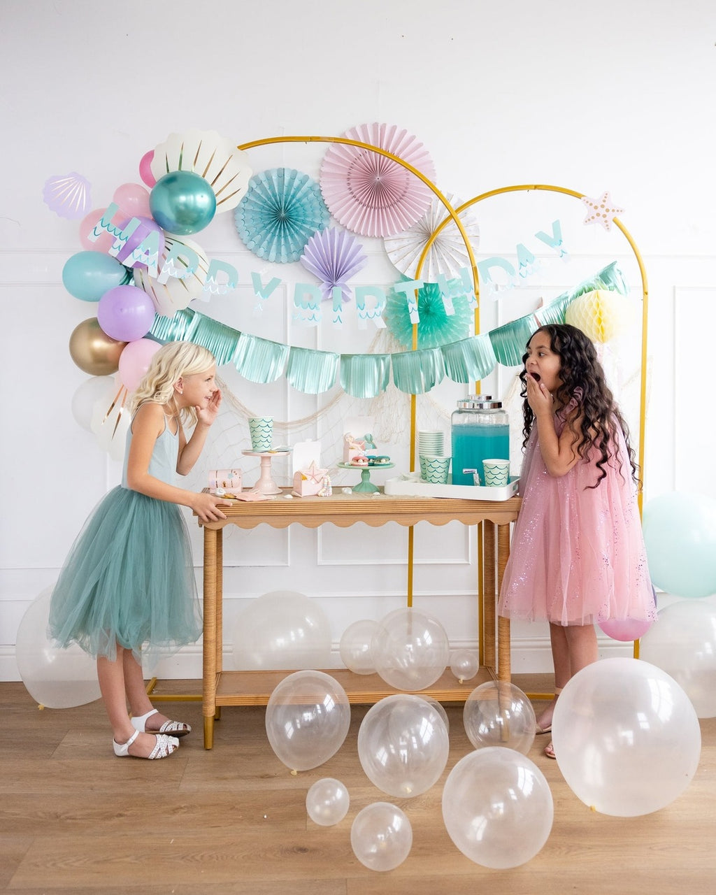 Pastel pink and teal birthday decorations with balloons for kids mermaid birthday from Parte Haus party supply store in Bethesda MD