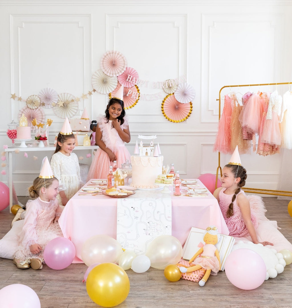 Pink princess birthday table decor with pastel balloons and children from Parte Haus party supply store in Bethesda MD