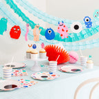 Multicolor monster birthday decorations kid theme tableware and garland from Parte Haus party supply store in Bethesda Maryland
