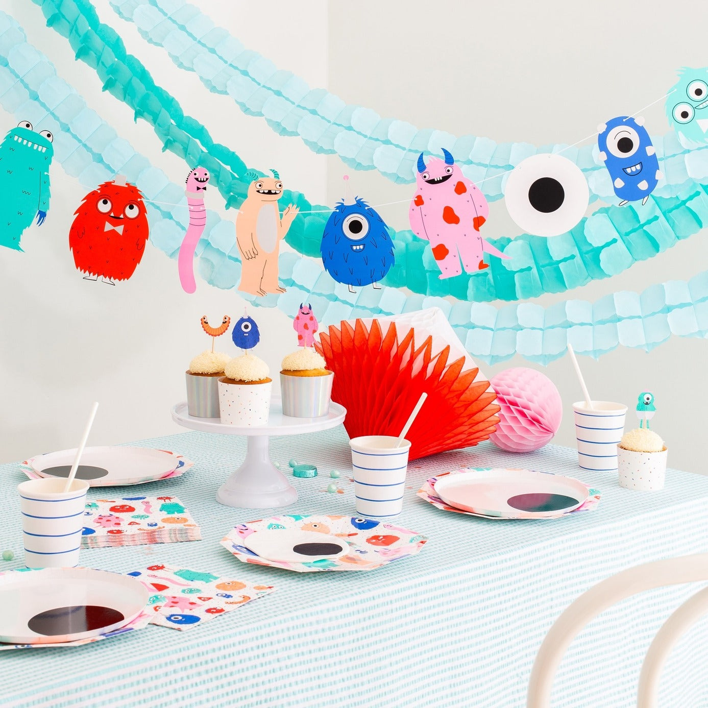 Multicolor monster birthday decorations kid theme tableware and garland from Parte Haus party supply store in Bethesda Maryland
