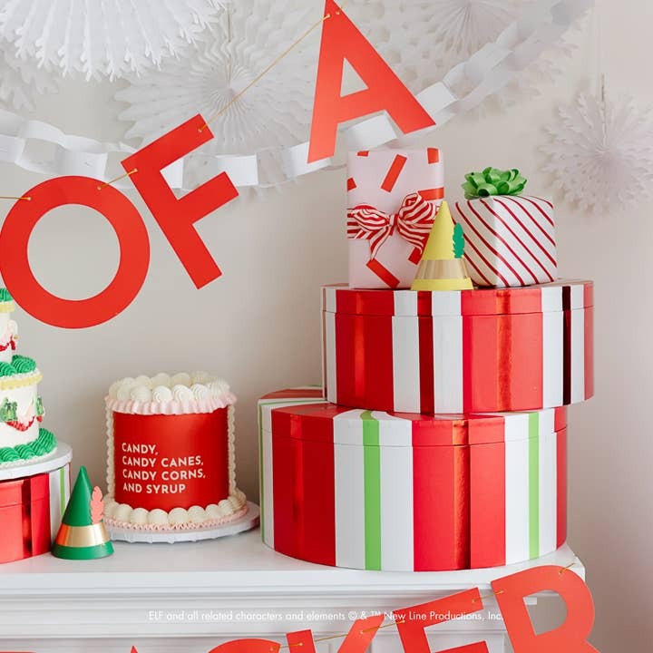 Red and white striped gift boxes with small hats holiday decor from Parte Haus party supply store in Bethesda MD