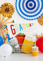 Multicolor graduation decorations with graduate pennant and balloons for graduation from Parte Haus party supply store in Bethesda MD