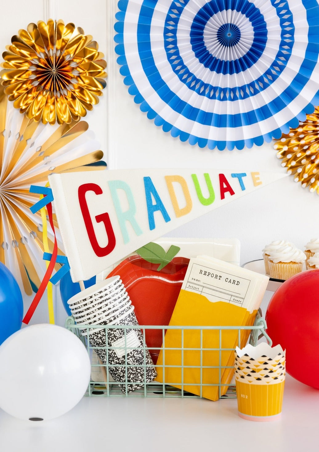Multicolor graduation decorations with graduate pennant and balloons for graduation from Parte Haus party supply store in Bethesda MD