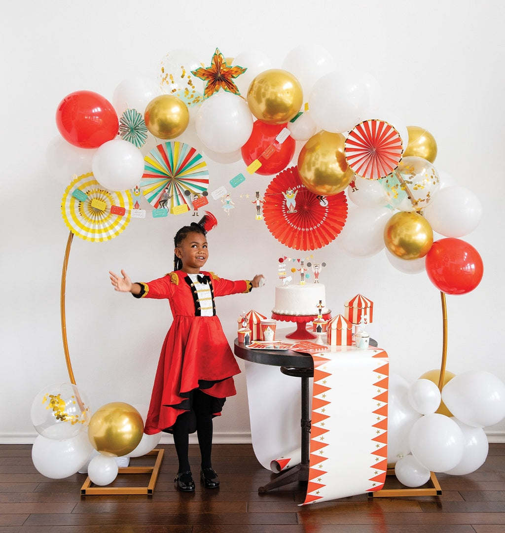 Red gold and white balloon garland with circus decorations birthday theme from Parte Haus party supply store in Bethesda MD