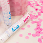 Pink and blue gender reveal confetti poppers with pink confetti from Parte Haus party supply store in Bethesda MD