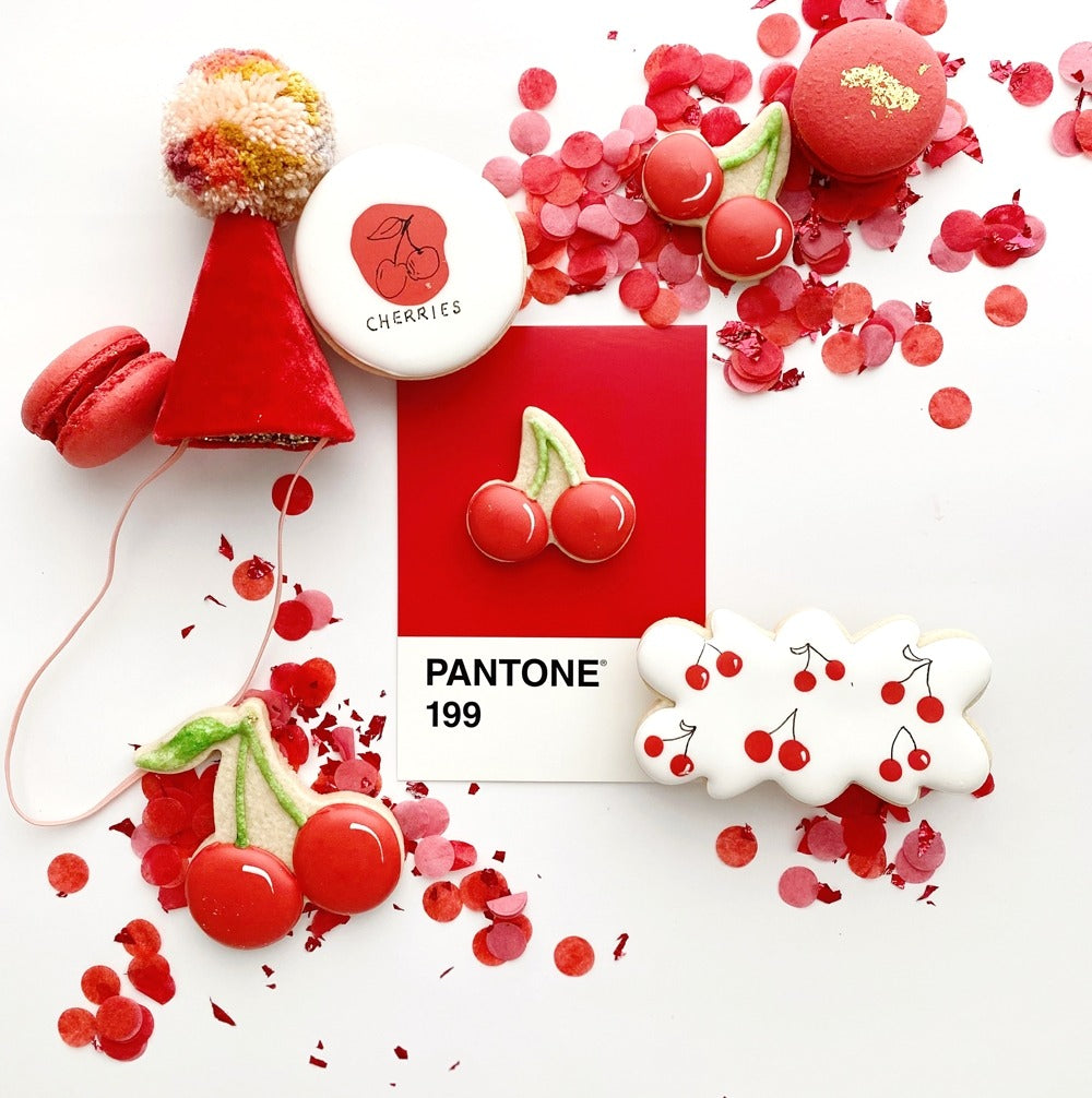 Red cherry theme cookies and macarons with confetti baking birthday from Parte Haus party supply store in Bethesda MD