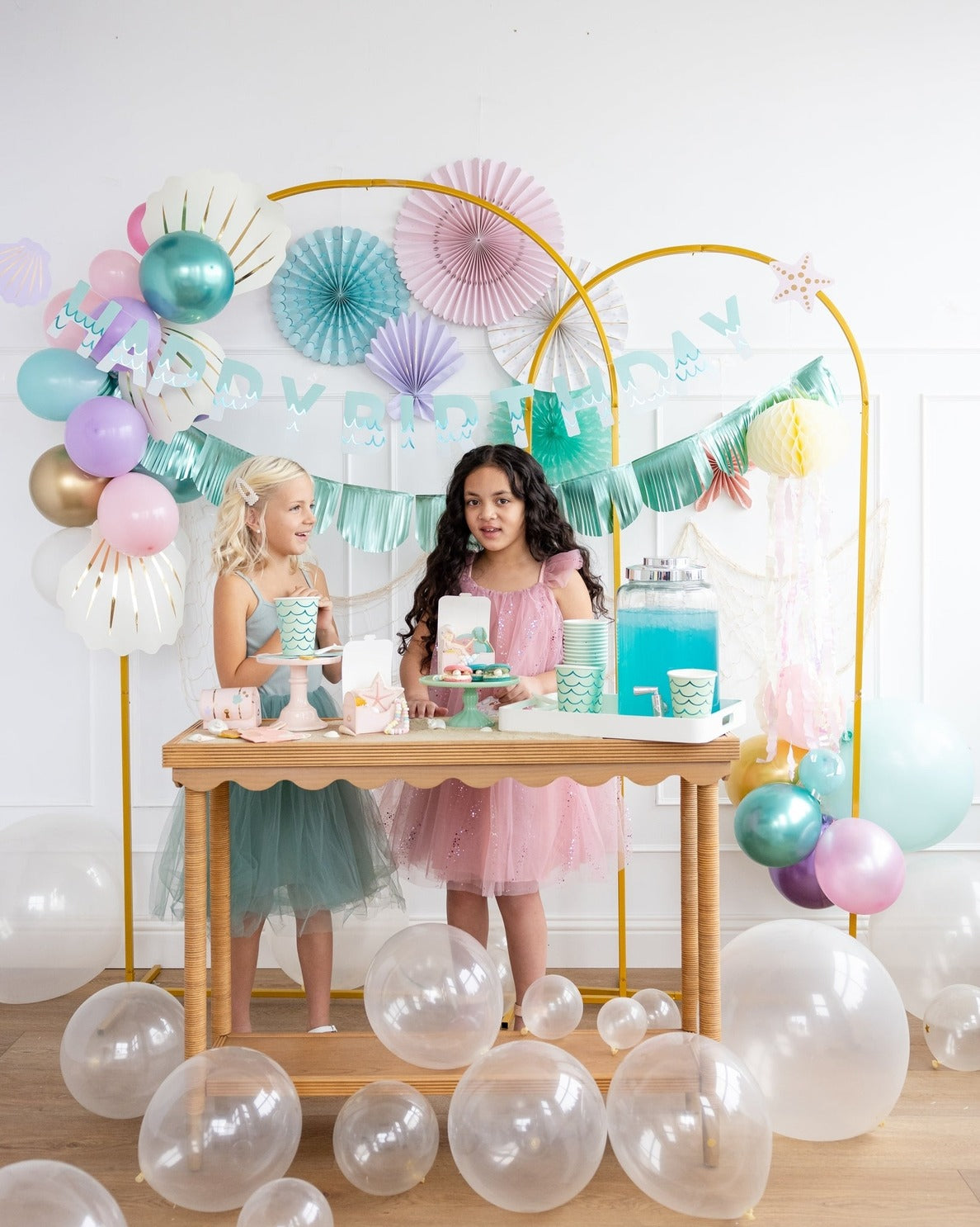 Pastel mermaid birthday decorations with balloons streamers and table display from Parte Haus party supply store in Bethesda MD