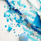 Blue confetti and silver star garland celebration decor for birthday from Parte Haus party supply store in Bethesda MD