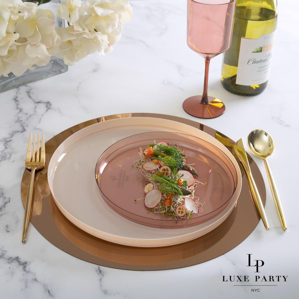 Blush pink dinnerware set with gold flatware and wine glass for elegant gatherings from Parte Haus party supply store in Bethesda Maryland