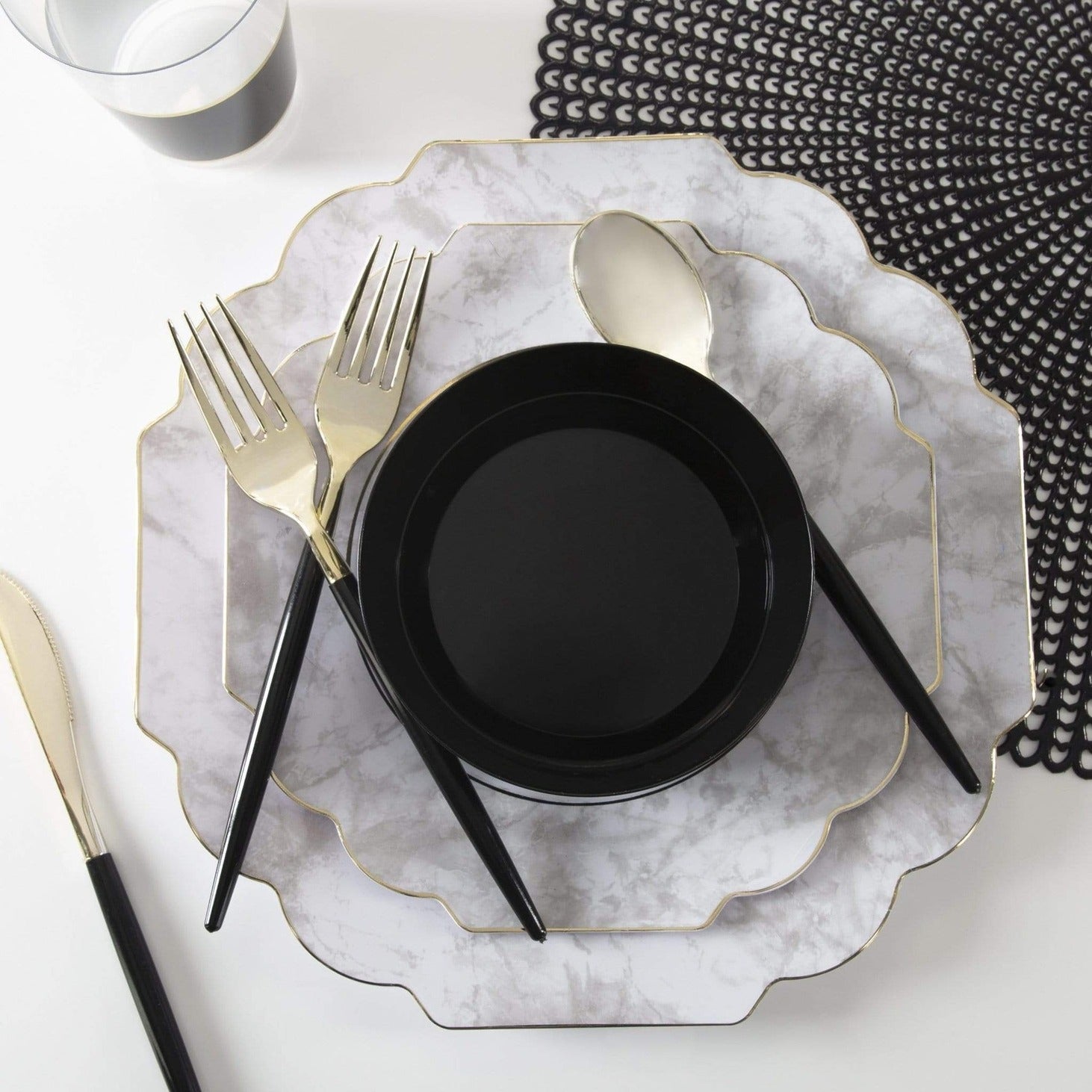 Black and marble grey tableware set with gold trim elegant table setting from Parte Haus party supply store in Bethesda Maryland
