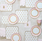 Pink and gold gingerbread themed plates and napkins for Christmas from Parte Haus party supply store in Bethesda MD