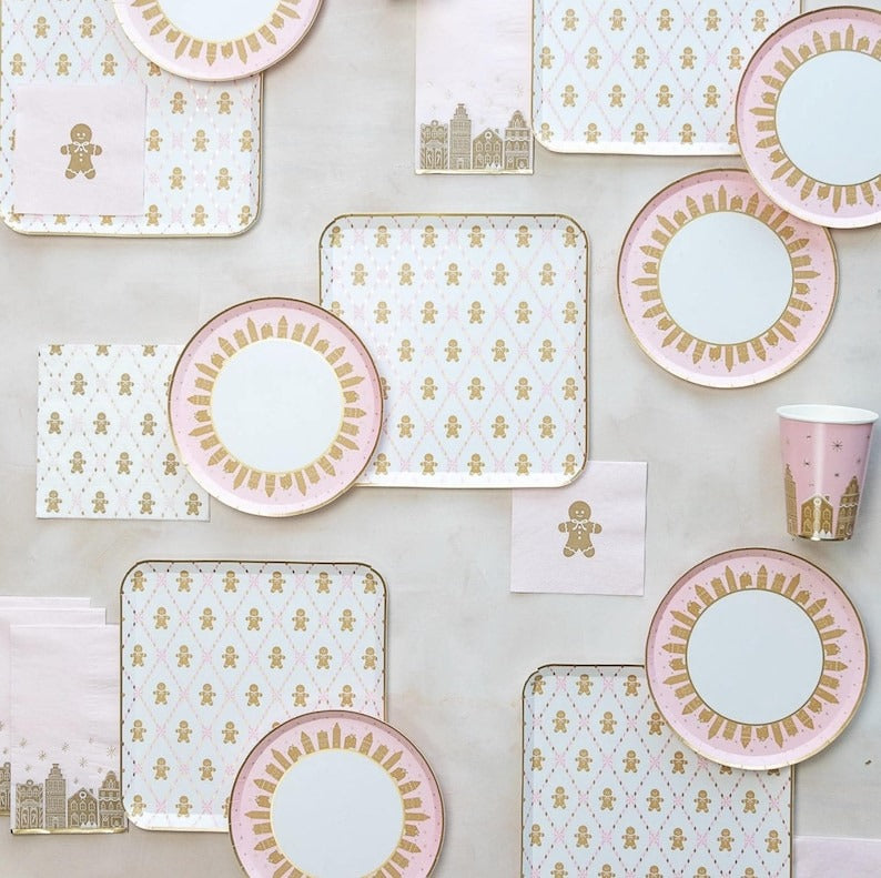 Pink and gold gingerbread themed plates and napkins for Christmas from Parte Haus party supply store in Bethesda MD