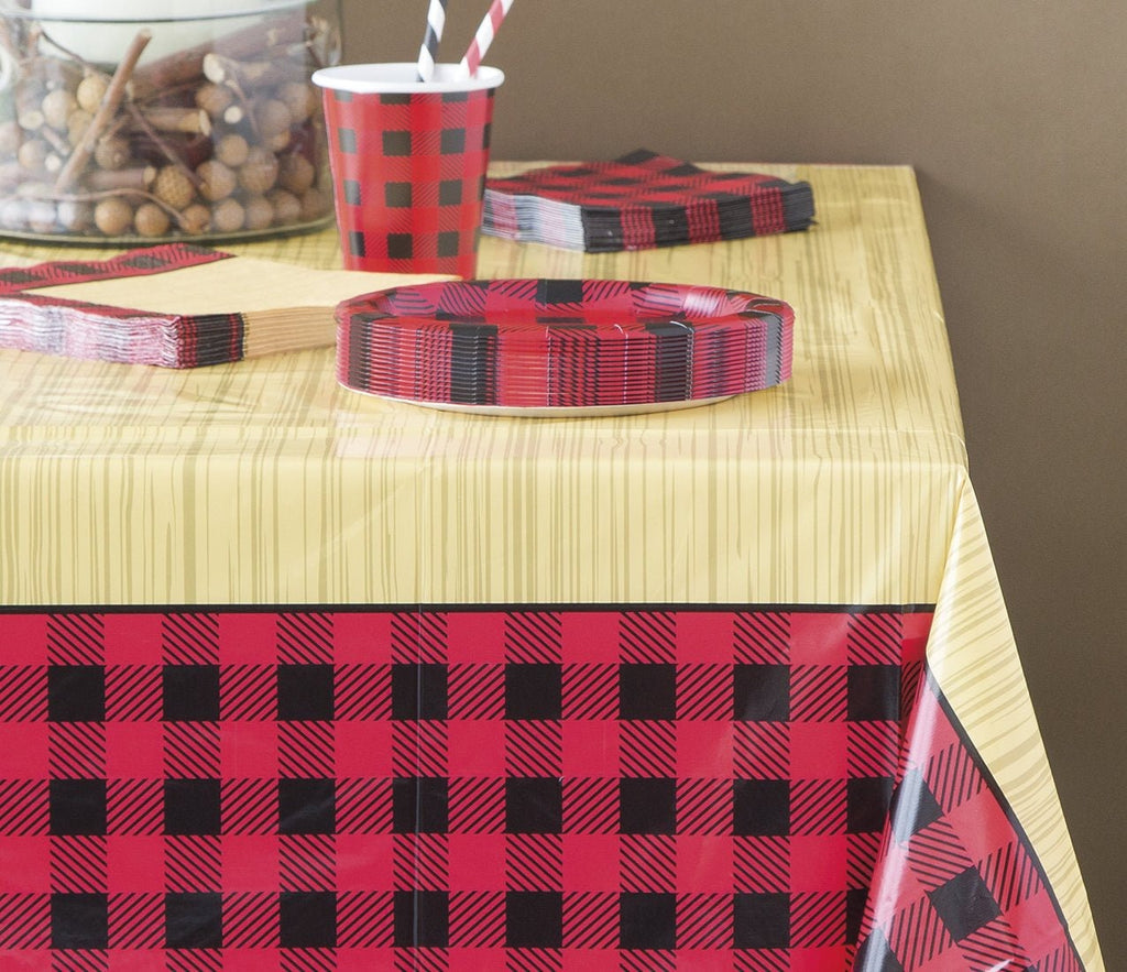 Red and black buffalo plaid tableware on a rustic table for lumberjack theme from Parte Haus party supply store in Bethesda Maryland