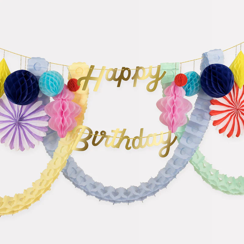 Multicolor birthday banner with honeycomb decorations and garlands birthday theme from Parte Haus party supply store in Bethesda MD