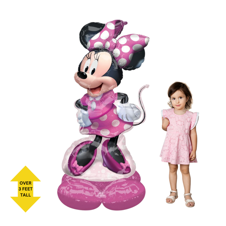 Life-size pink Minnie Mouse 48in foil balloon shown next to child - from Parte Haus party supply store in Bethesda, Maryland.