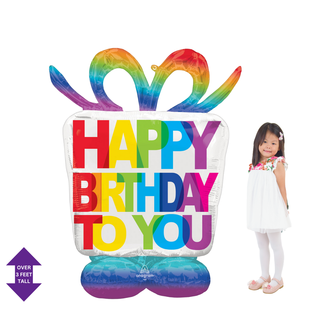 Rainbow giant birthday gift box foil balloon with colorful bow for birthday celebration from Parte Haus party supply store in Bethesda Maryland