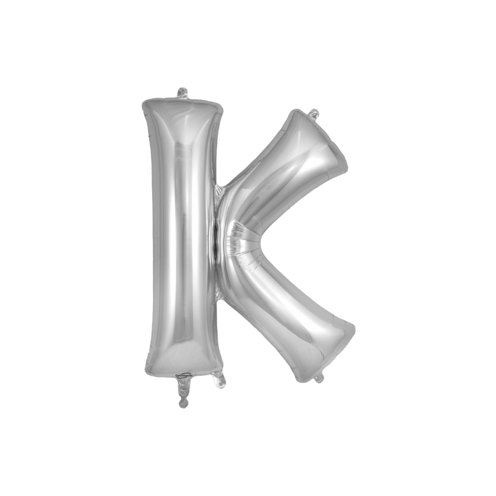 Silver 34in letter K foil balloon for birthday parties – from Parte Haus party supply store in Bethesda, Maryland.