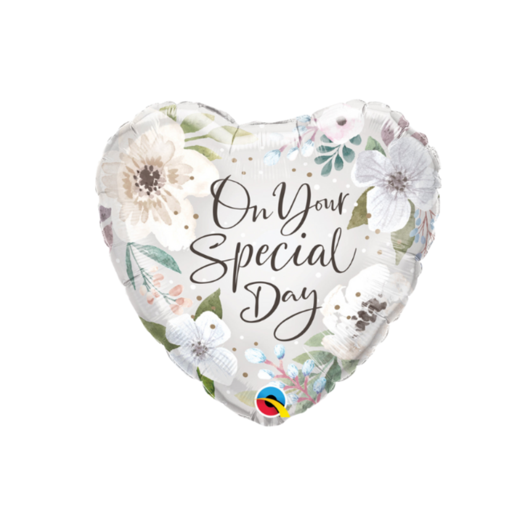 White 18in floral heart foil balloon with elegant script – from Parte Haus party supply store in Bethesda, Maryland.